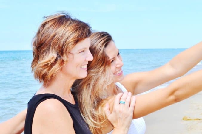 mom and daughter taking selfie 