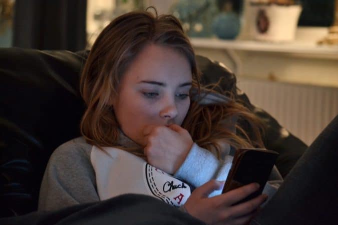 teenage girl on her phone 