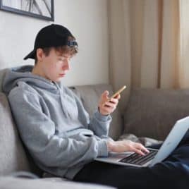 teen boy on laptop