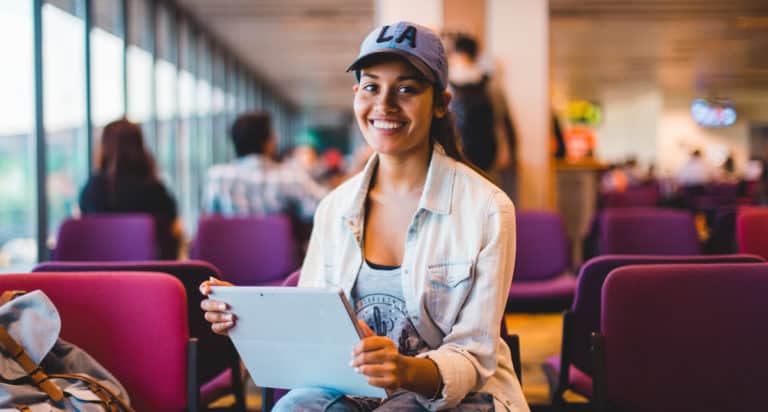 young woman sitting in the airport