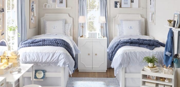 twin beds in a blue and white dorm room