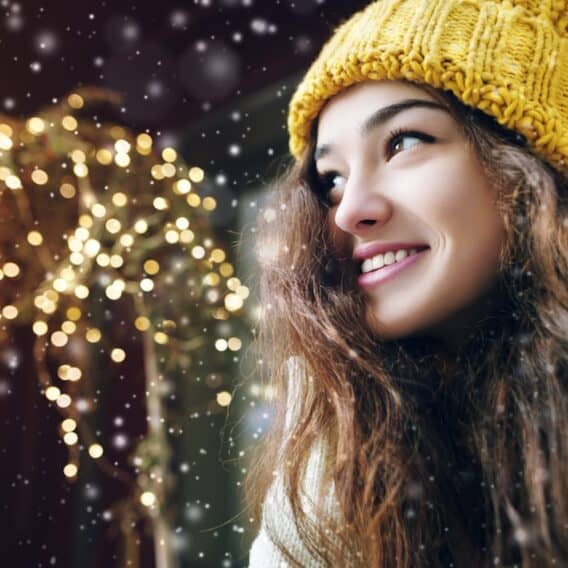 young woman with holiday lights