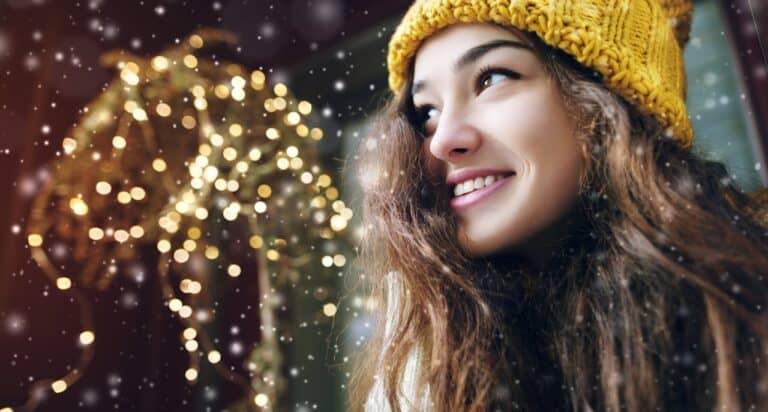 young woman with holiday lights